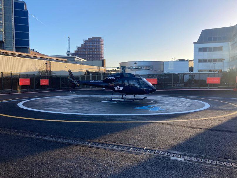 Eurocopter AS355 helicopter on the apron at London Heliport, Battersea
