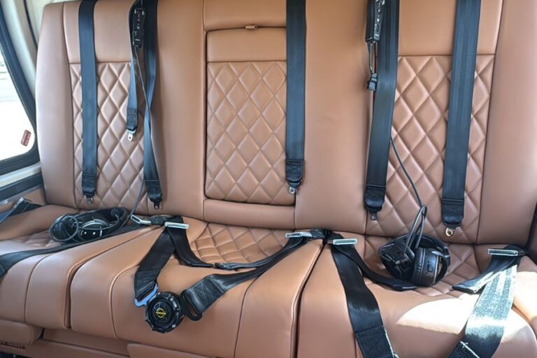 Tan diamond-stitched leather seats inside the Agusta 109 Grand helicopter cabin