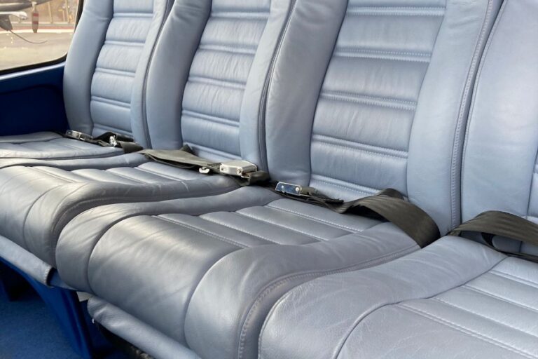 Grey leather bench seat inside the Eurocopter AS355 Twin Squirrel helicopter cabin