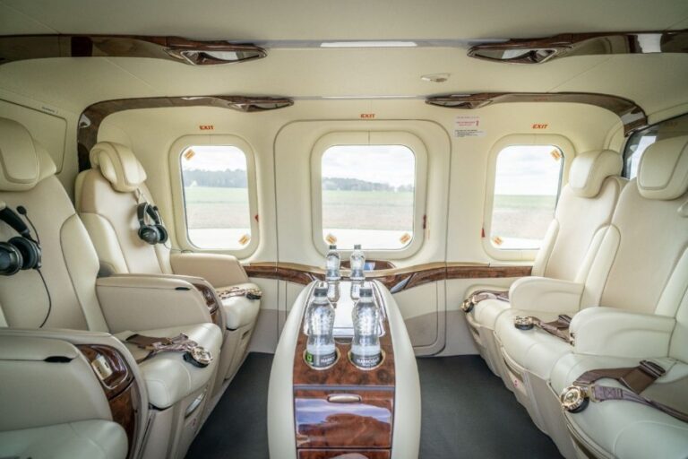 Cream leather VIP cabin of the Leonardo AW139 helicopter with polished-wood detailing